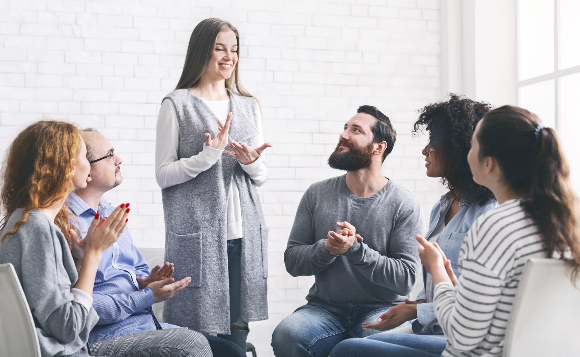 a group of people clapping hands